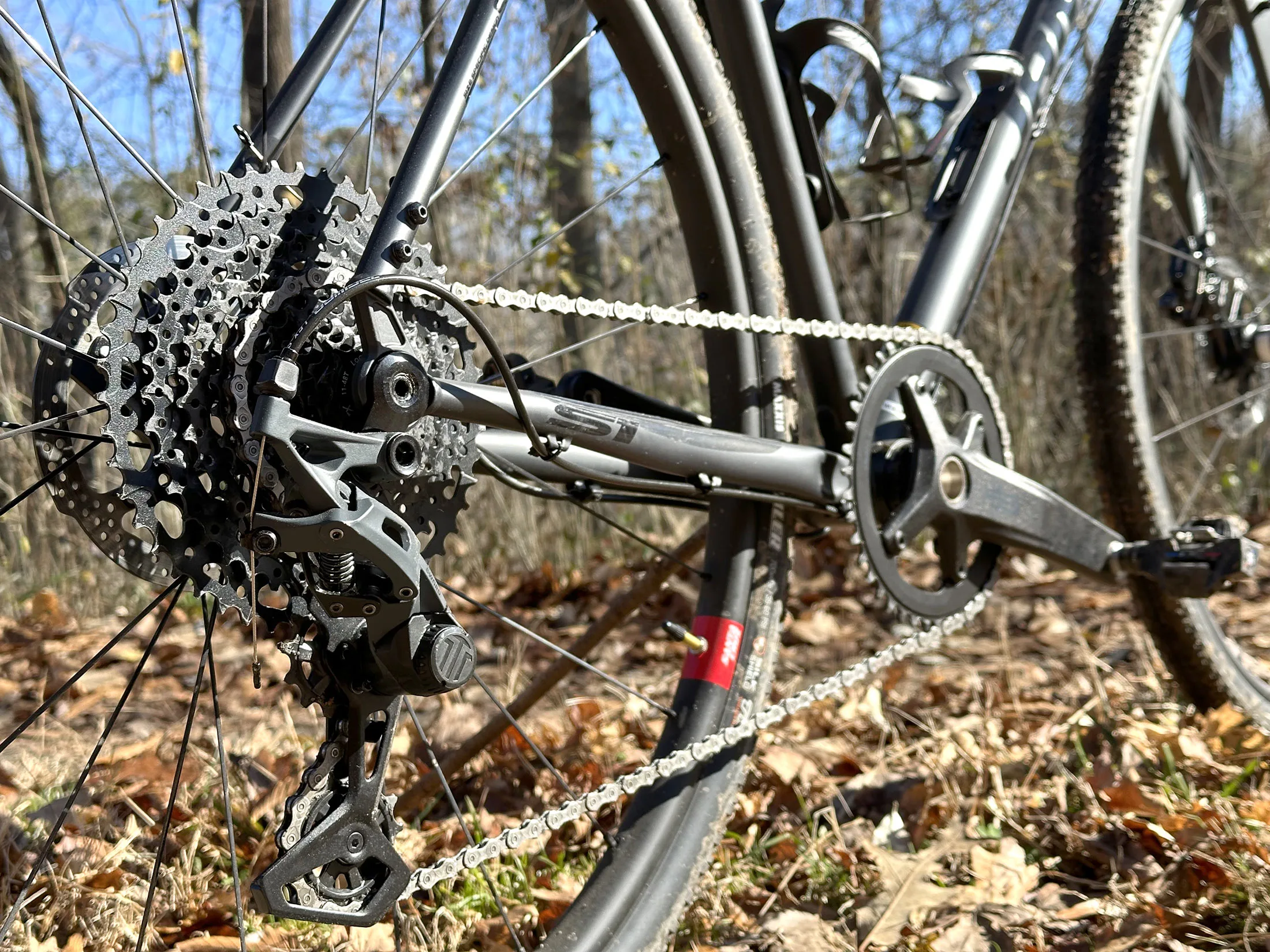 closeup of microshift sword gravel group gravel bike rear derailleur and cassette.
