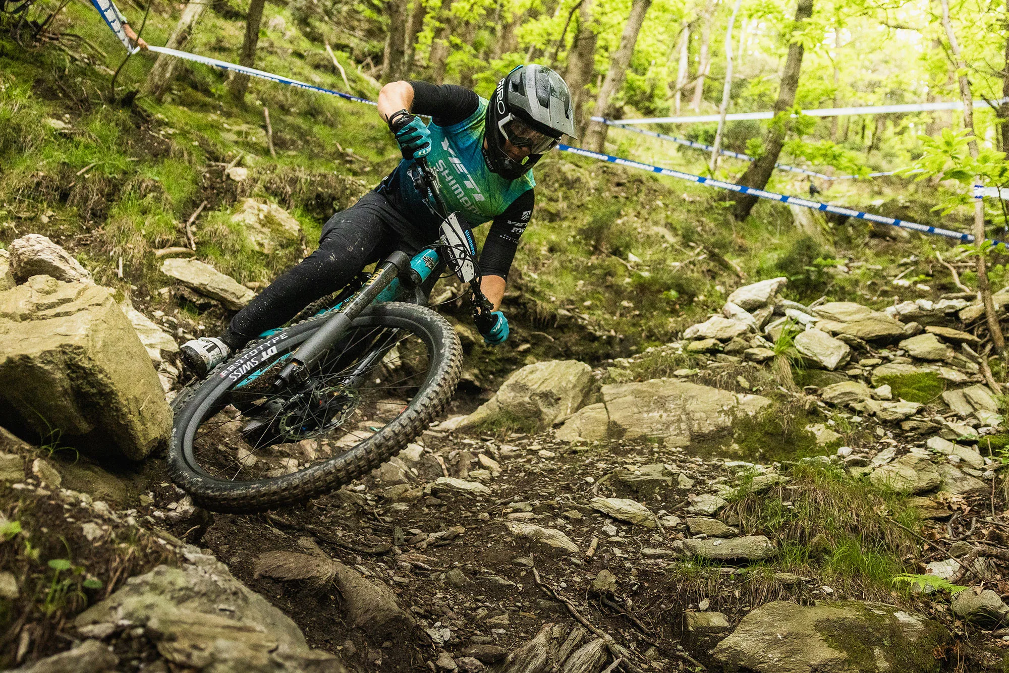 mountain biker racing on the new fox podium inverted enduro fork.
