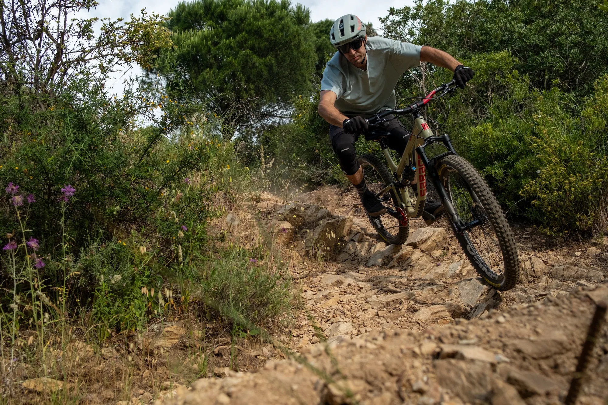 a mountain biker riding aggressive rocky terrain with the Formula Selva V fork.