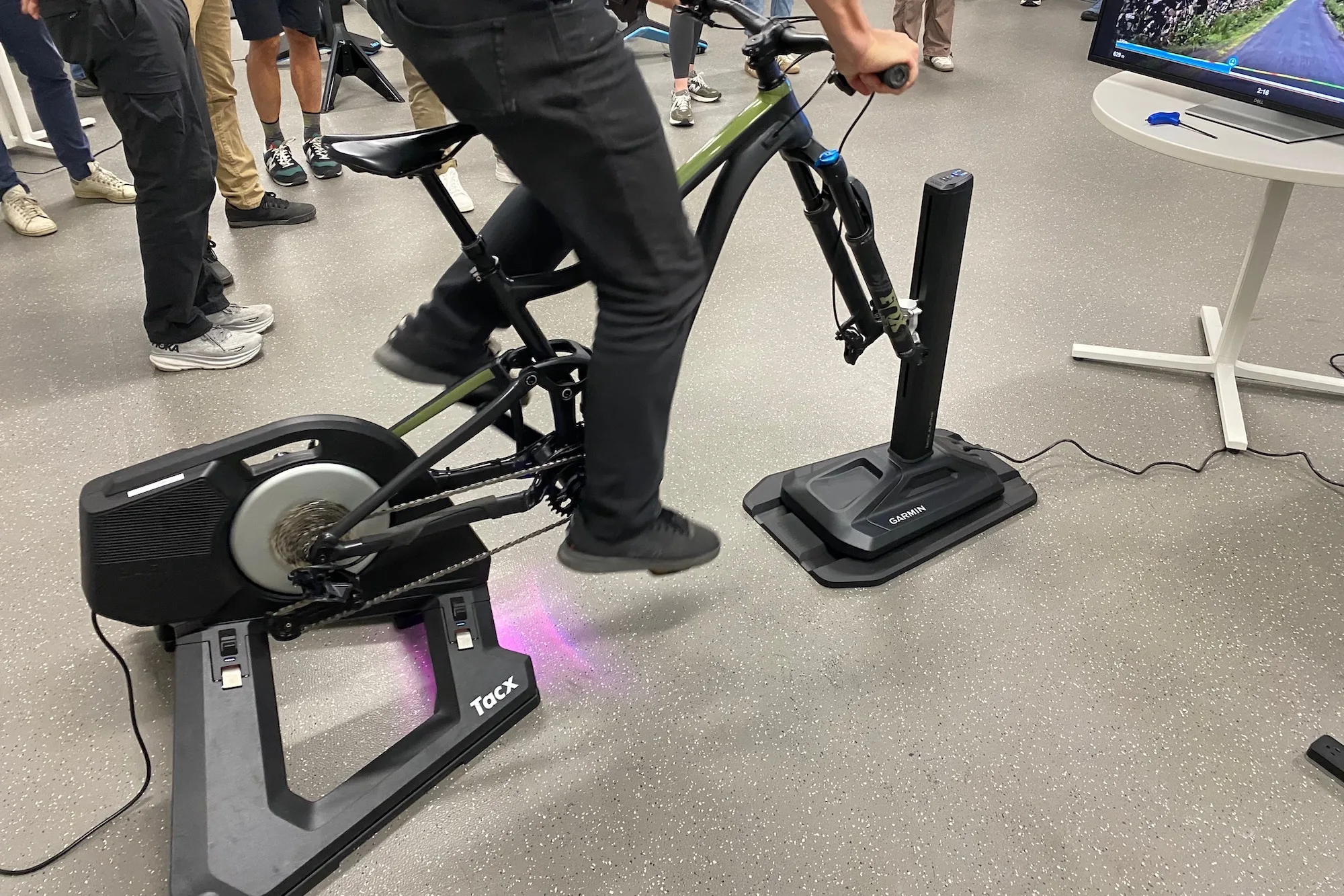 A member of the cycling media doing a quick test ride on the TacX Alpine
