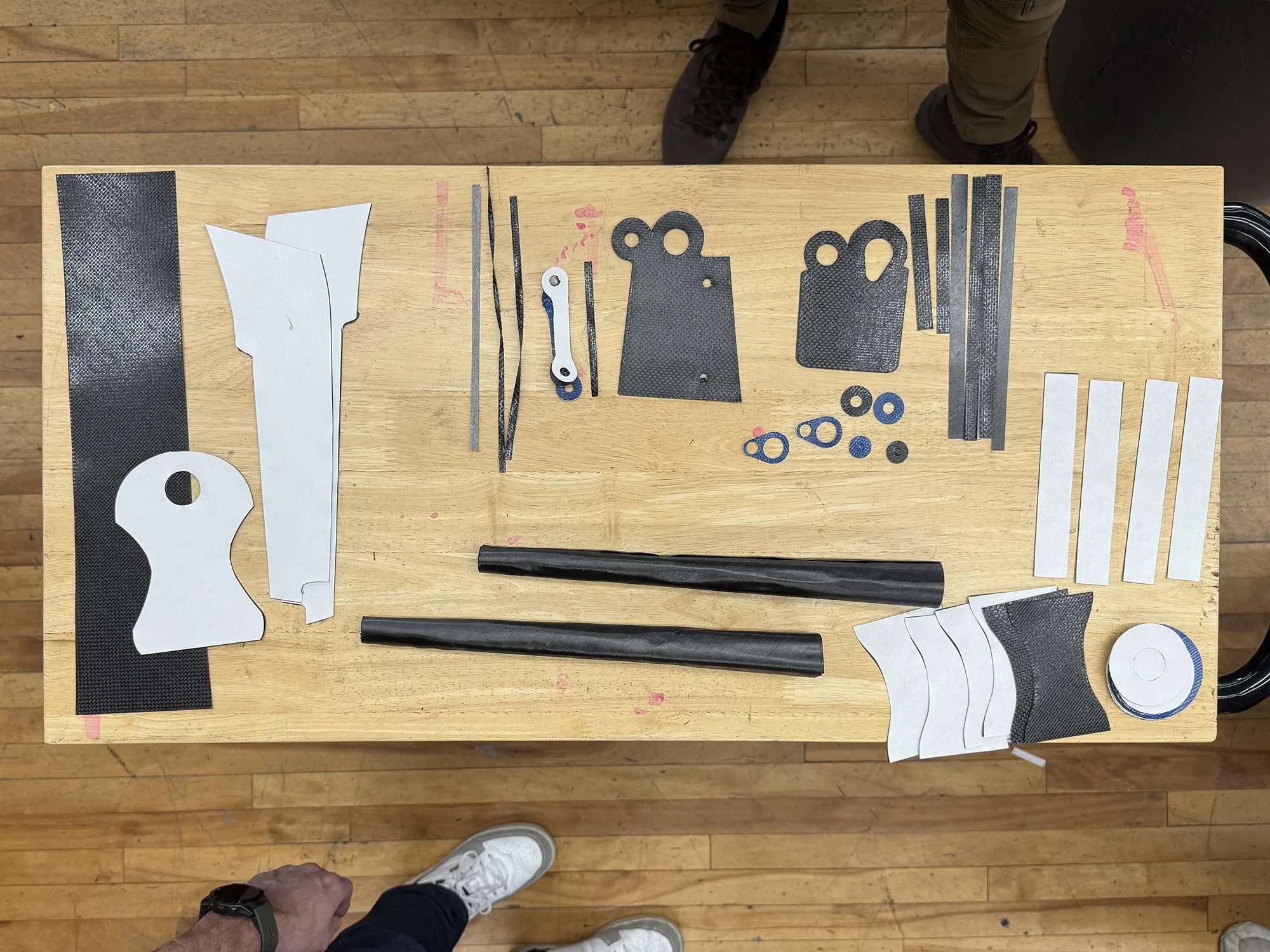 parlee factory work table with carbon fiber pieces used to make a road bike fork.