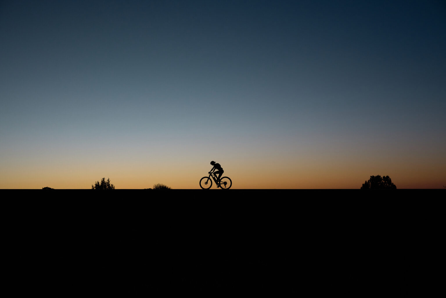 Hannah Otto on the White Rim at sunrise