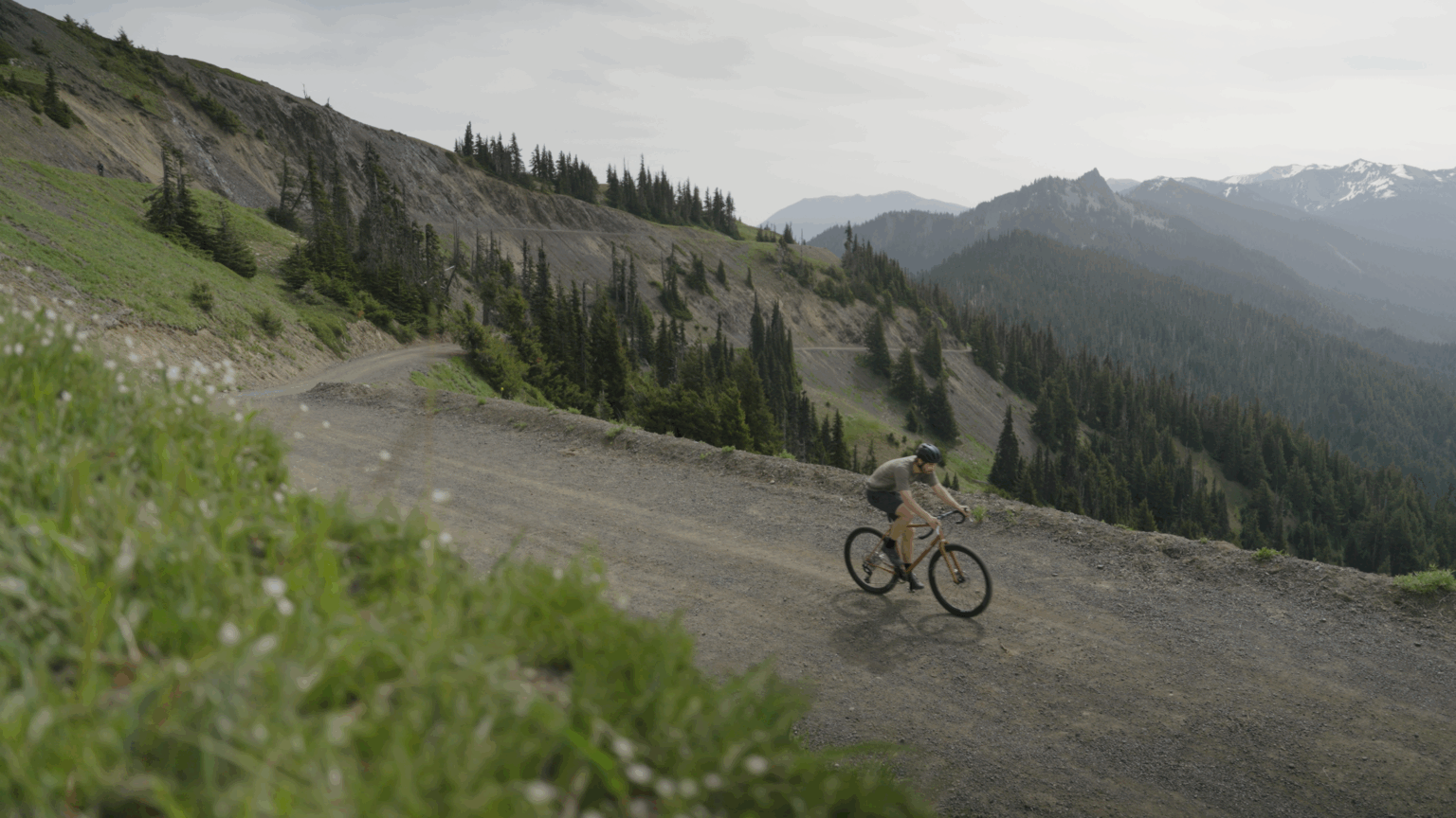 riding on a mountain gravel road on a Pine Cycles FRST