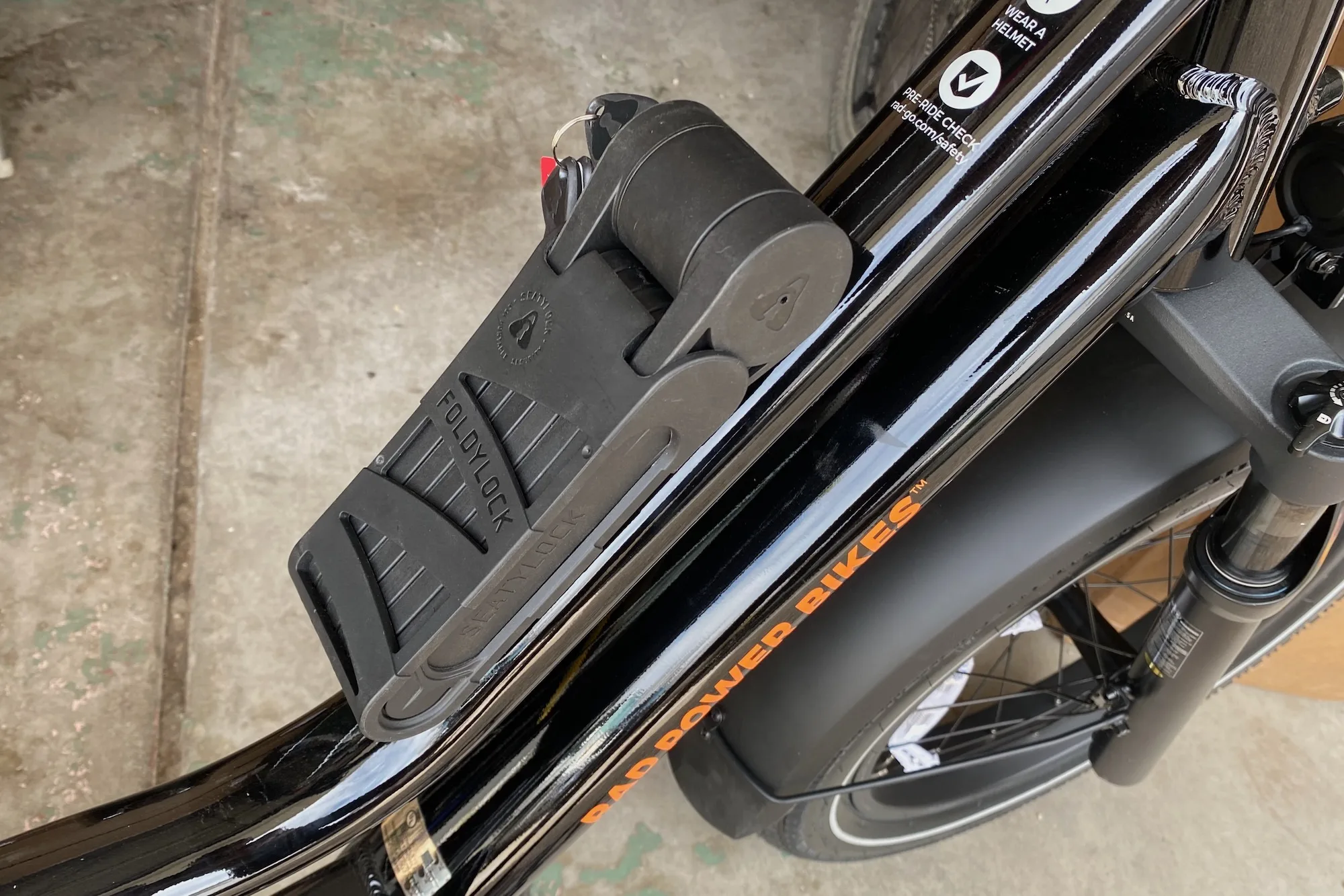 The Foldylock Foever in its mounting bracket mounted on a Rad Power radWagon 5