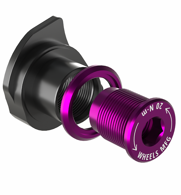 An image of a purple Wheels Mfg UDH dropout for a single speed conversion