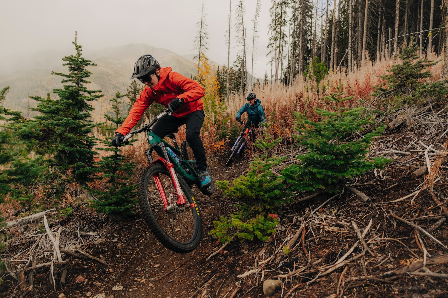 two people riding bikes in the new Guardian jacekts.