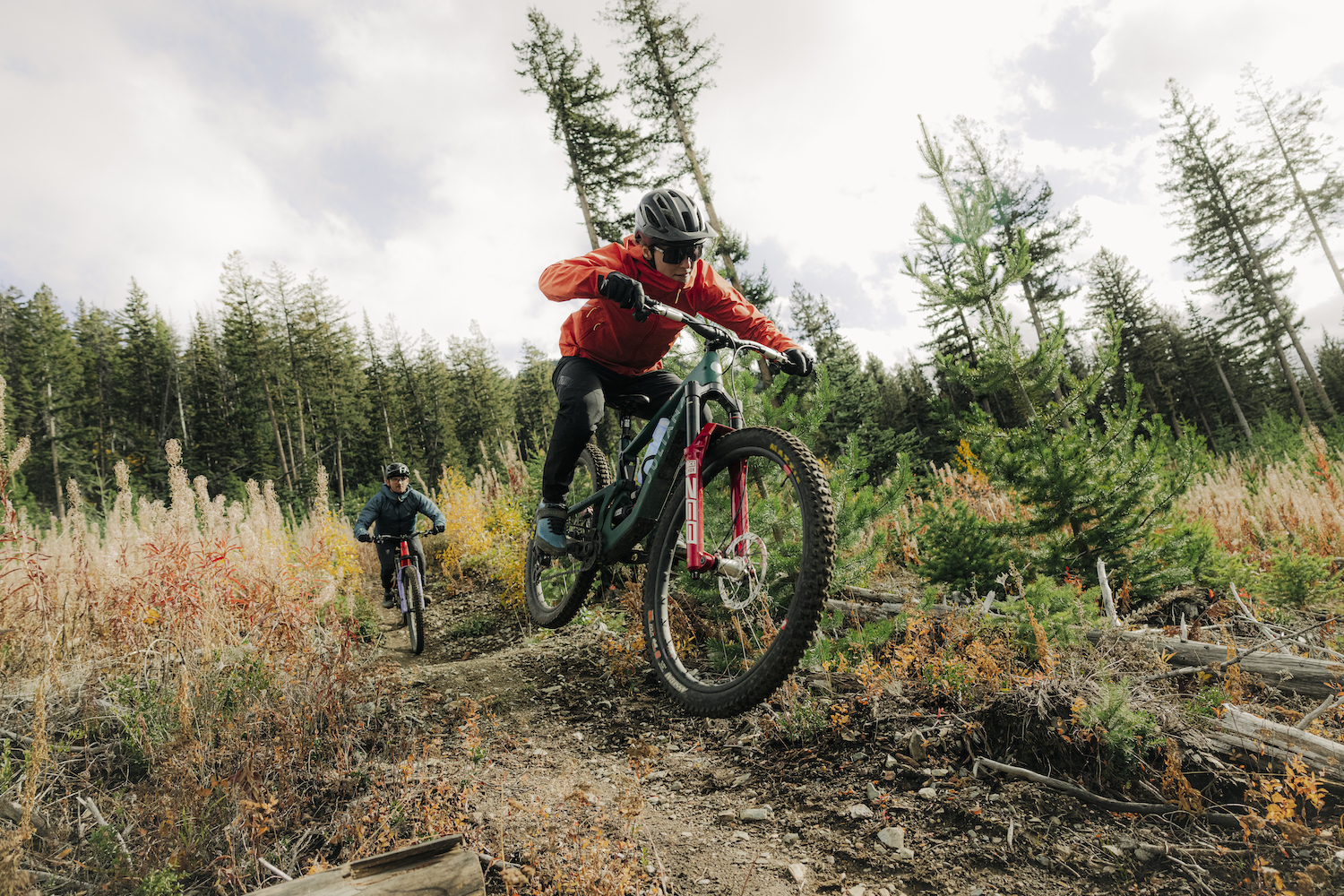 Two mountain bikers riding in the new 7Mesh Guardian jackets