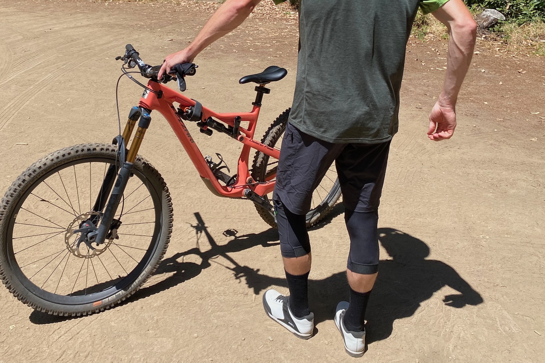 wearing the Fox Enduro Pro knee guards and standing around, as viewed from the back.