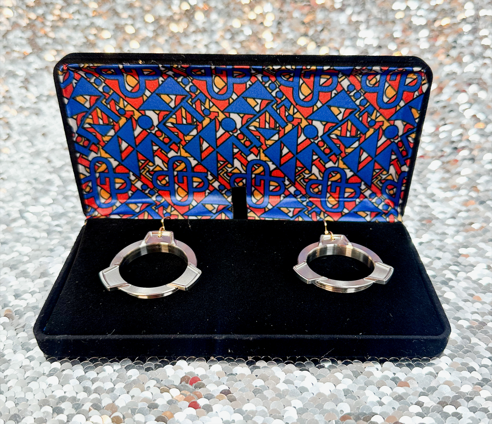 Ogle Component Design Wow What studio Anna Schwinn titanium earring