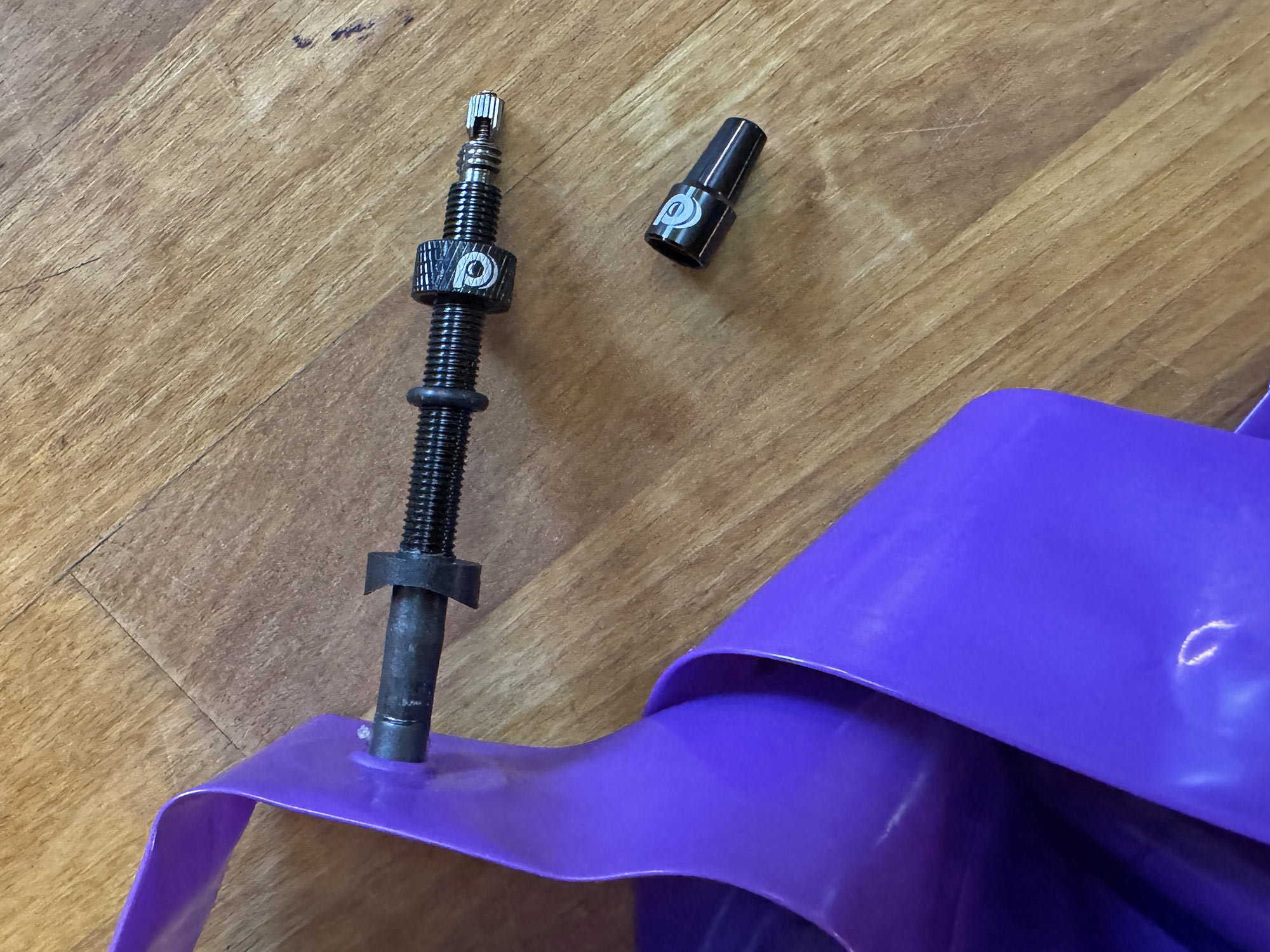 Panaracer Purple Lite lightweight TPU inner tubes for road & gravel bikes, plastic + alloy valve detail