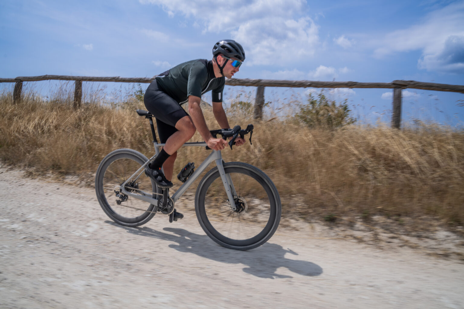 a cyclist riding Vision's SC 48 i25 wheels