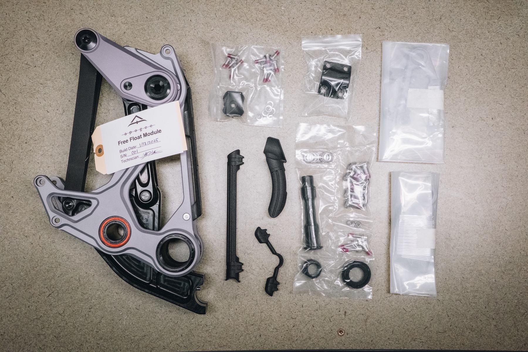an assembled Free Float Module and all of its hardware waiting for a frame to be assembled.