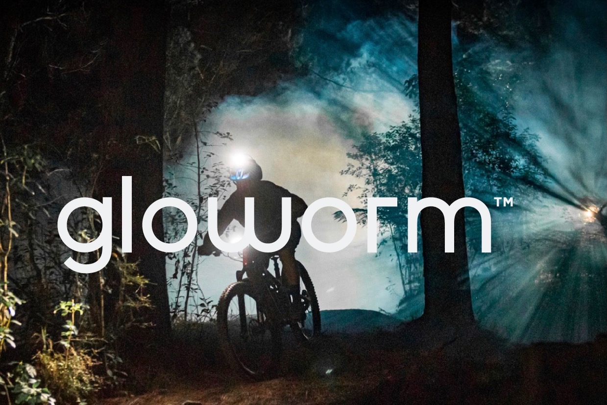 Screen shot of someone riding with the new gloworm CX Core at night with the Gloworm logo superimposed over it.