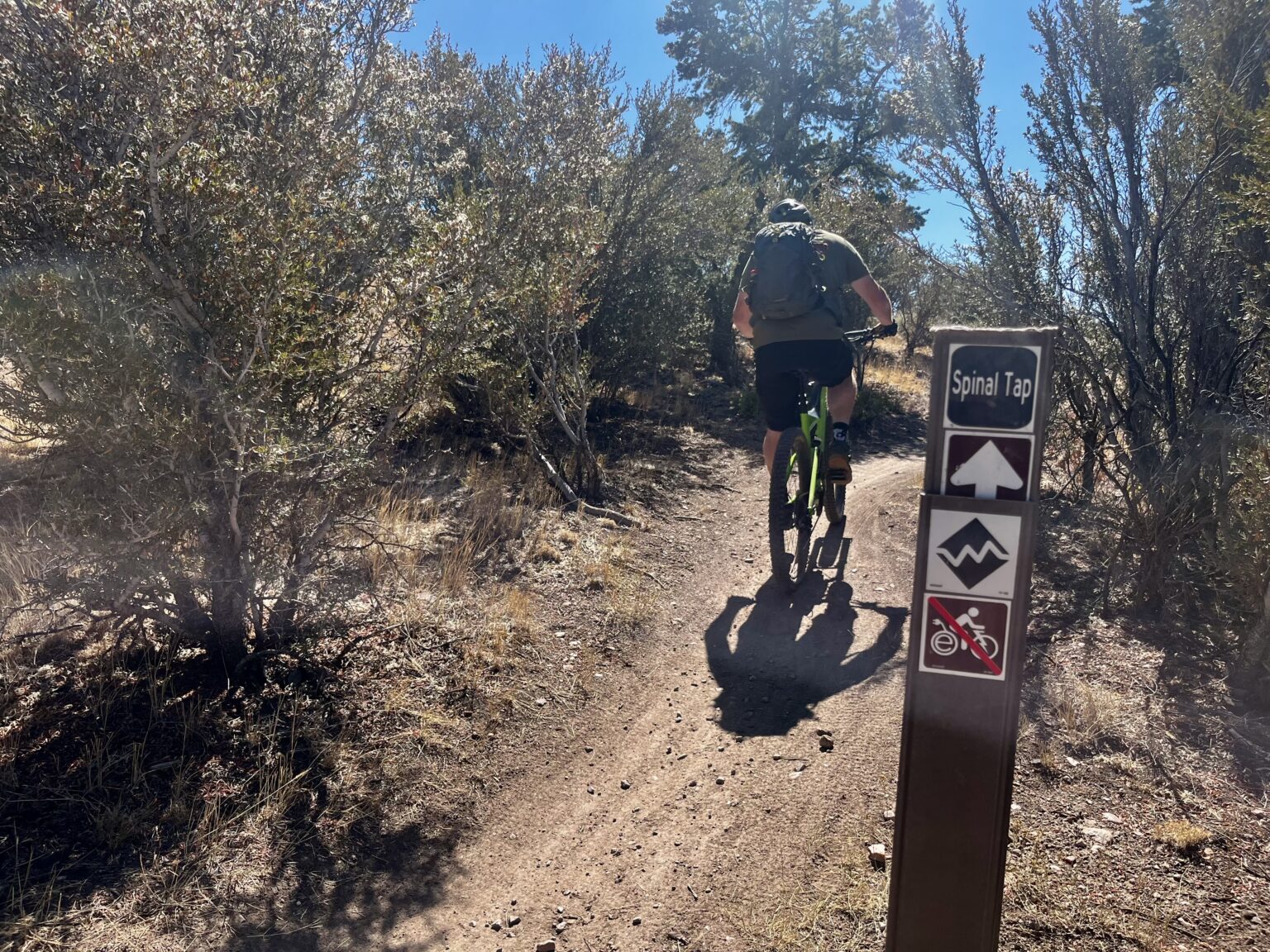A mountain biker continuing on a section of Spinal Tap