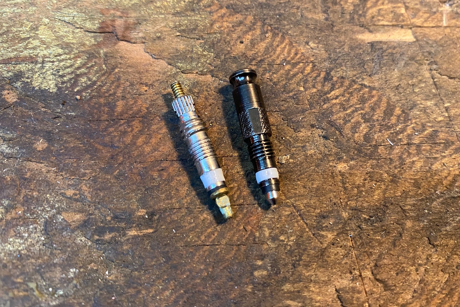 a presta valve next to a clik valve for comparison
