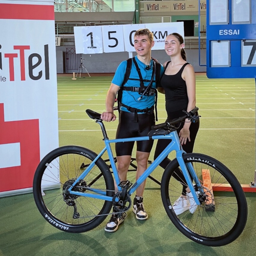 Delaite posing with a female after setting a new wheelie world record.