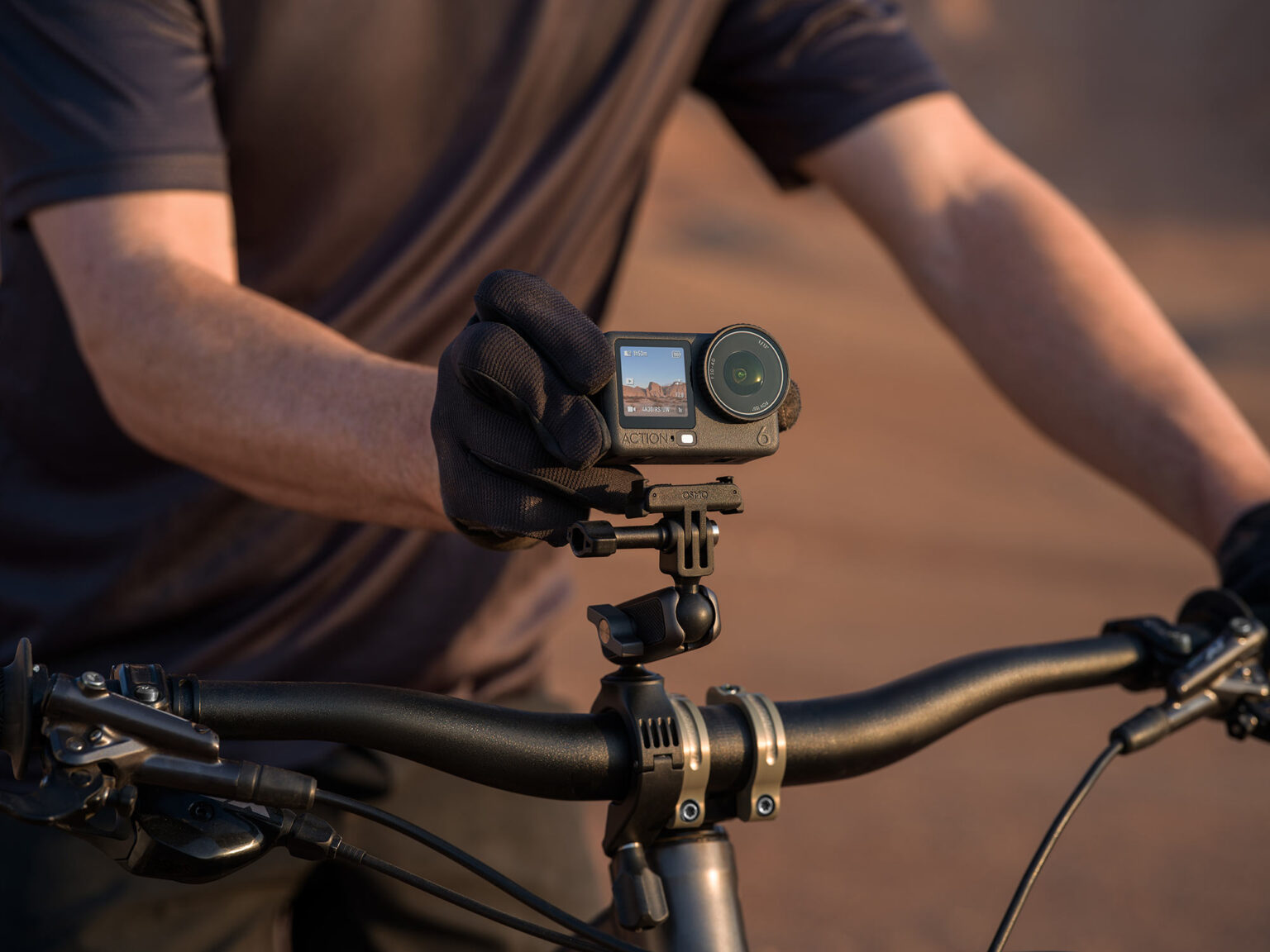 dji osmo action 6 on a MTB handlebar.