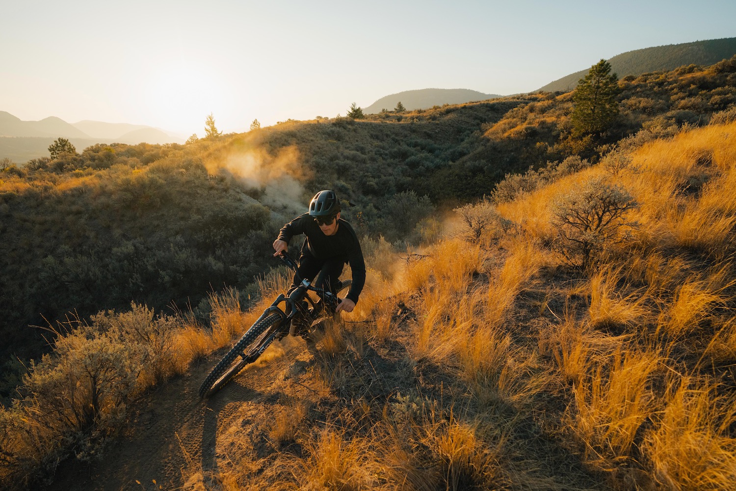 a man riding the new Evil Offering in a desert landscape