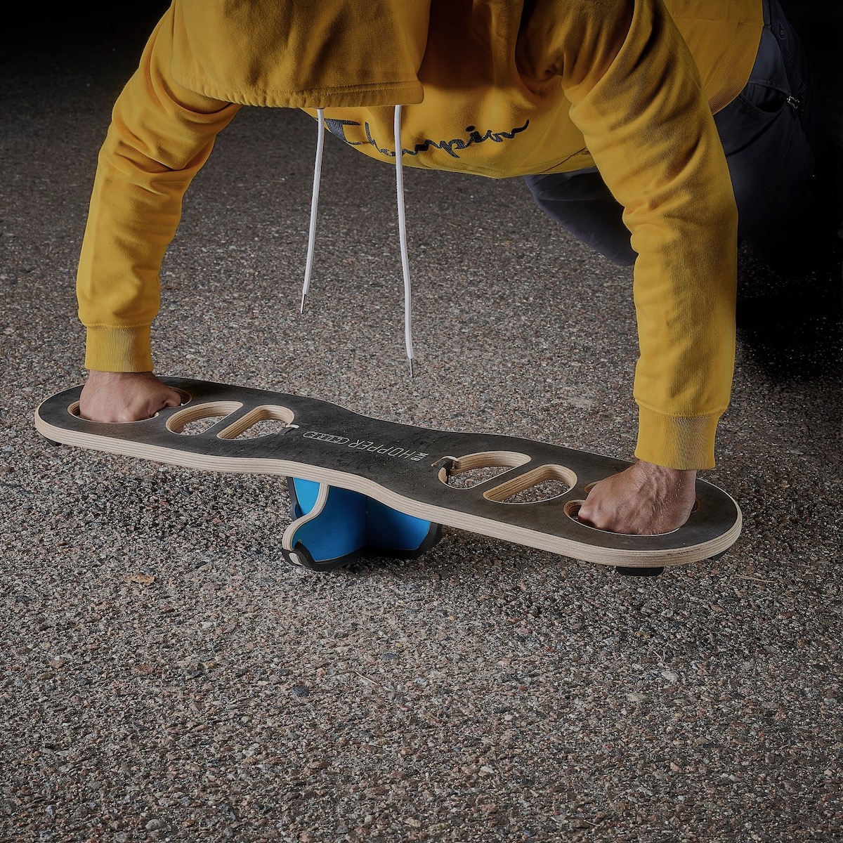 stock image of a person doing a push-up on the MTB Hopper Core Balance trainer