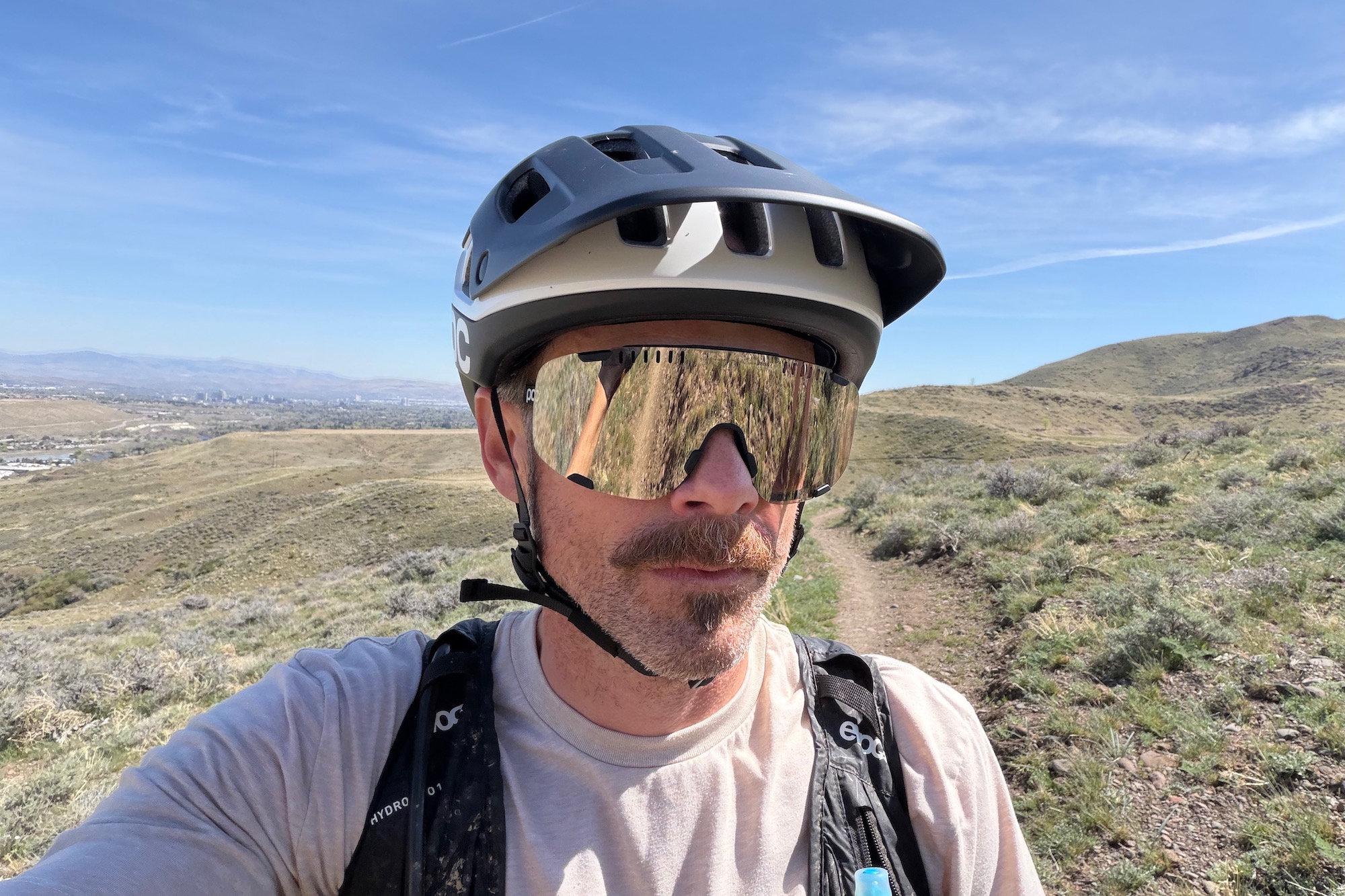 wearing the POC devour sunglasses with a POC helmet
