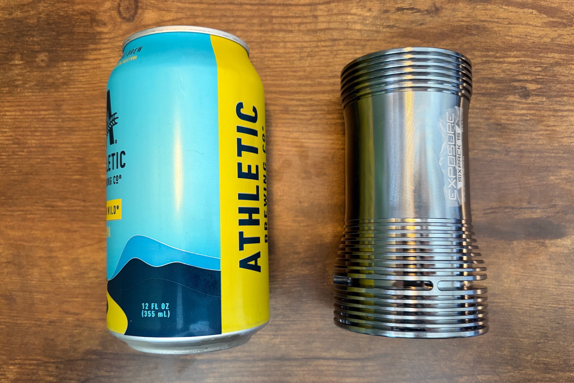 Comparing the size of a 12 ounce can and the Six-Pack 15 to show the light's size.