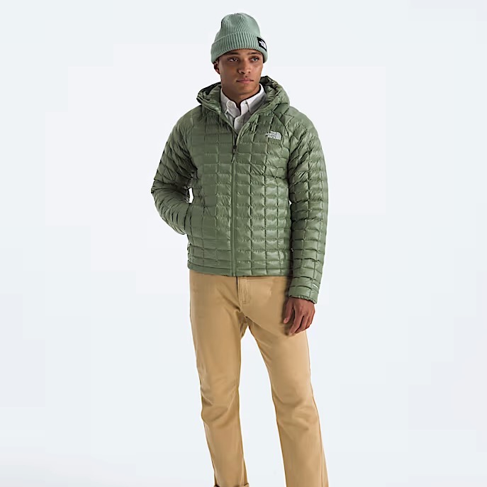 studio image of a man wearing the North Face Thermoball Hooded Jacket viewed from the front