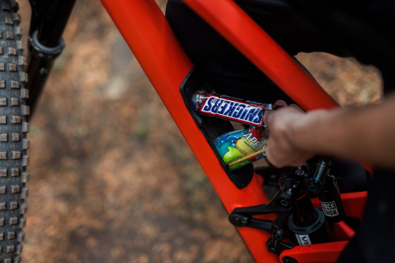 pulling snacks out of the lunch box in-frame storage compartment