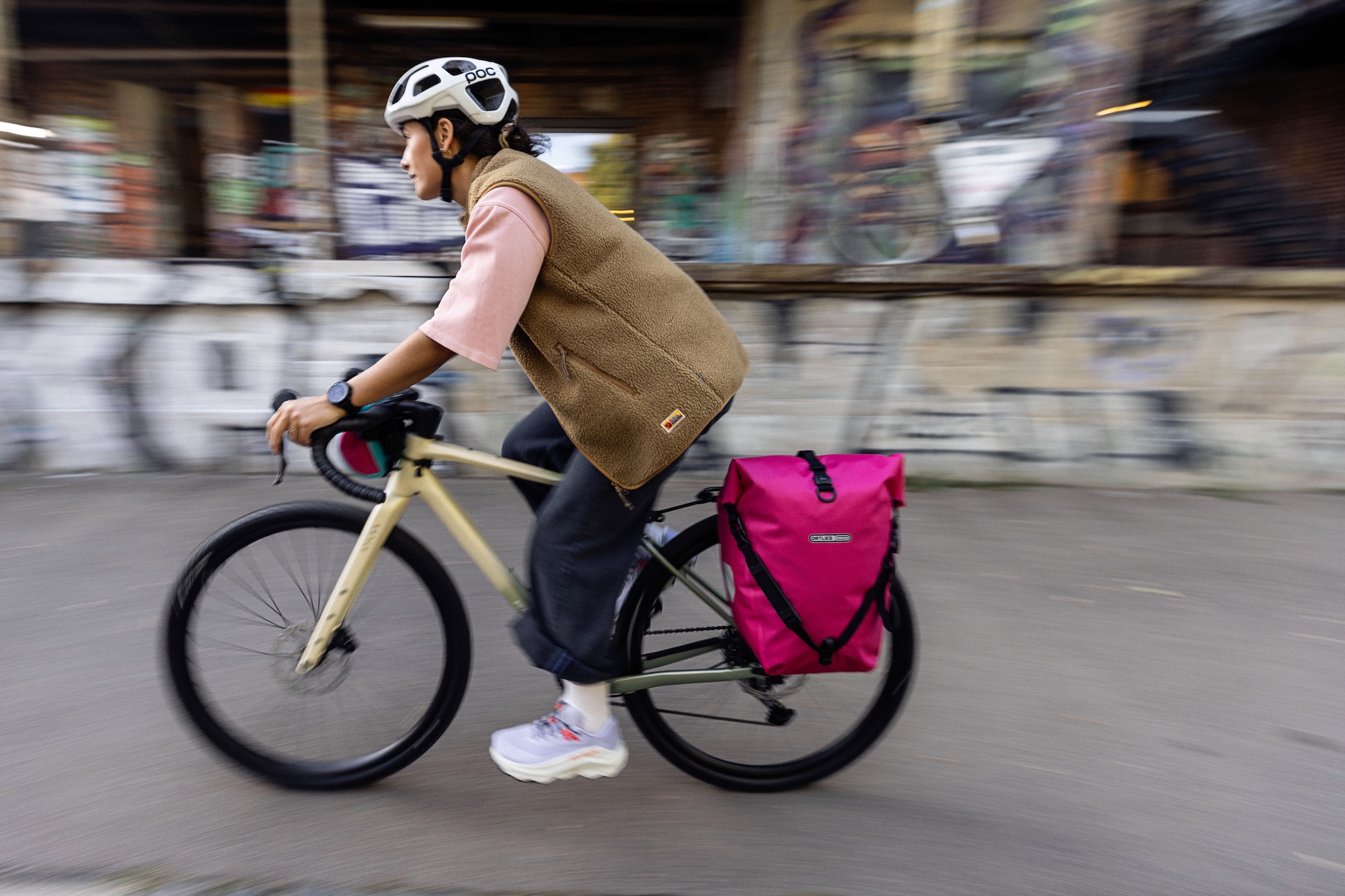 a person riding a bike through the city withe Ortlieb Back-Roller Pannier