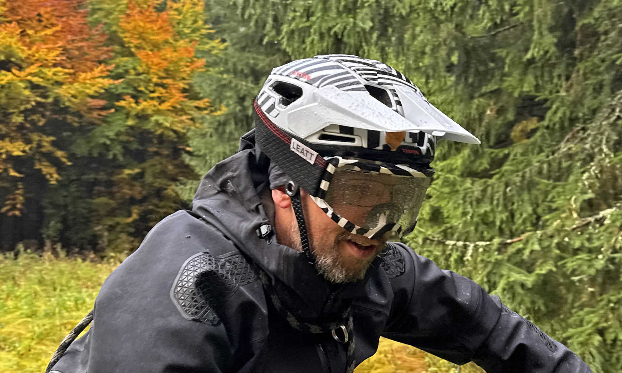 Canyon Deflector RLS affordable mountain bike helmet with Release Layer System anti-rotation safety, with rainy goggles