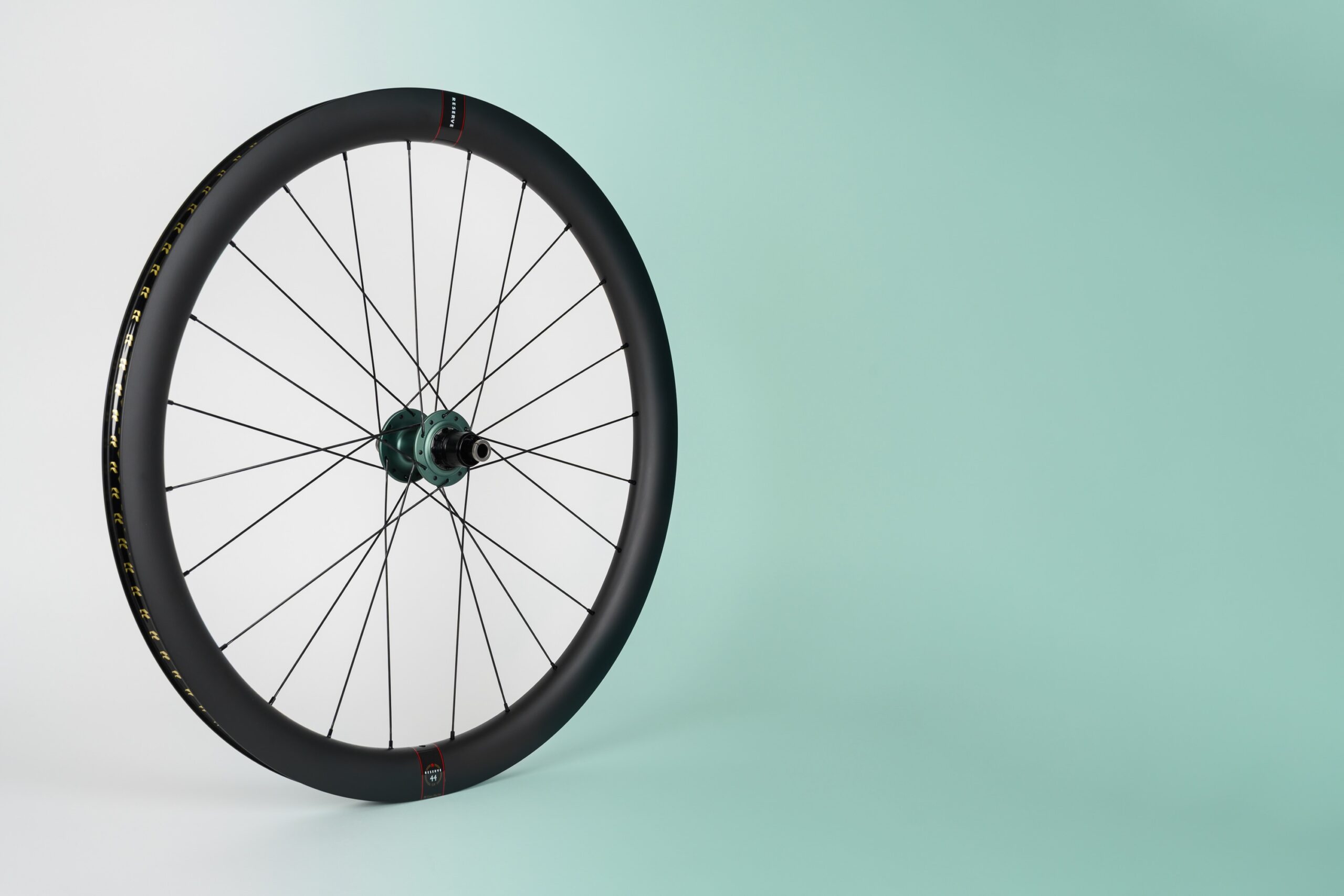 stock image of a bike wheel with a Chris King hub and a Reserve rim.