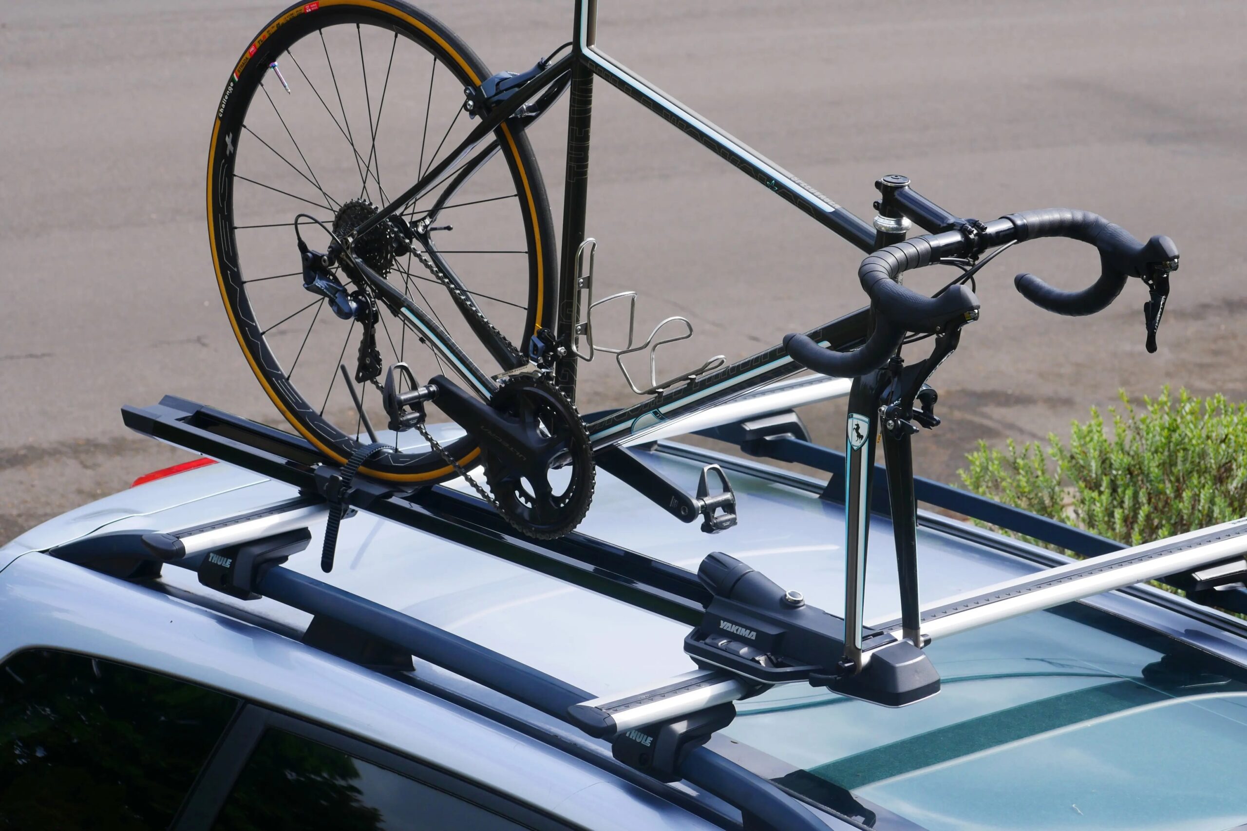 A road bike mounted to the Yakima HighSpeed roof bike rack