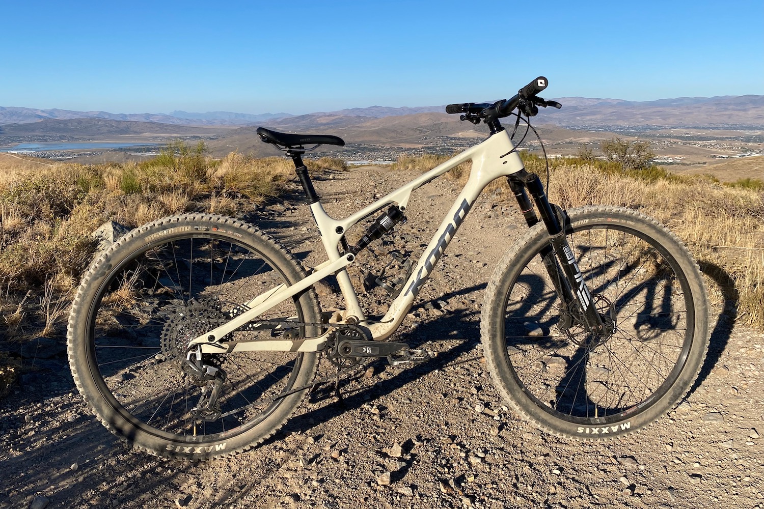 side profile shot of the Kona Hei Hei on top of a mountain in the desert.