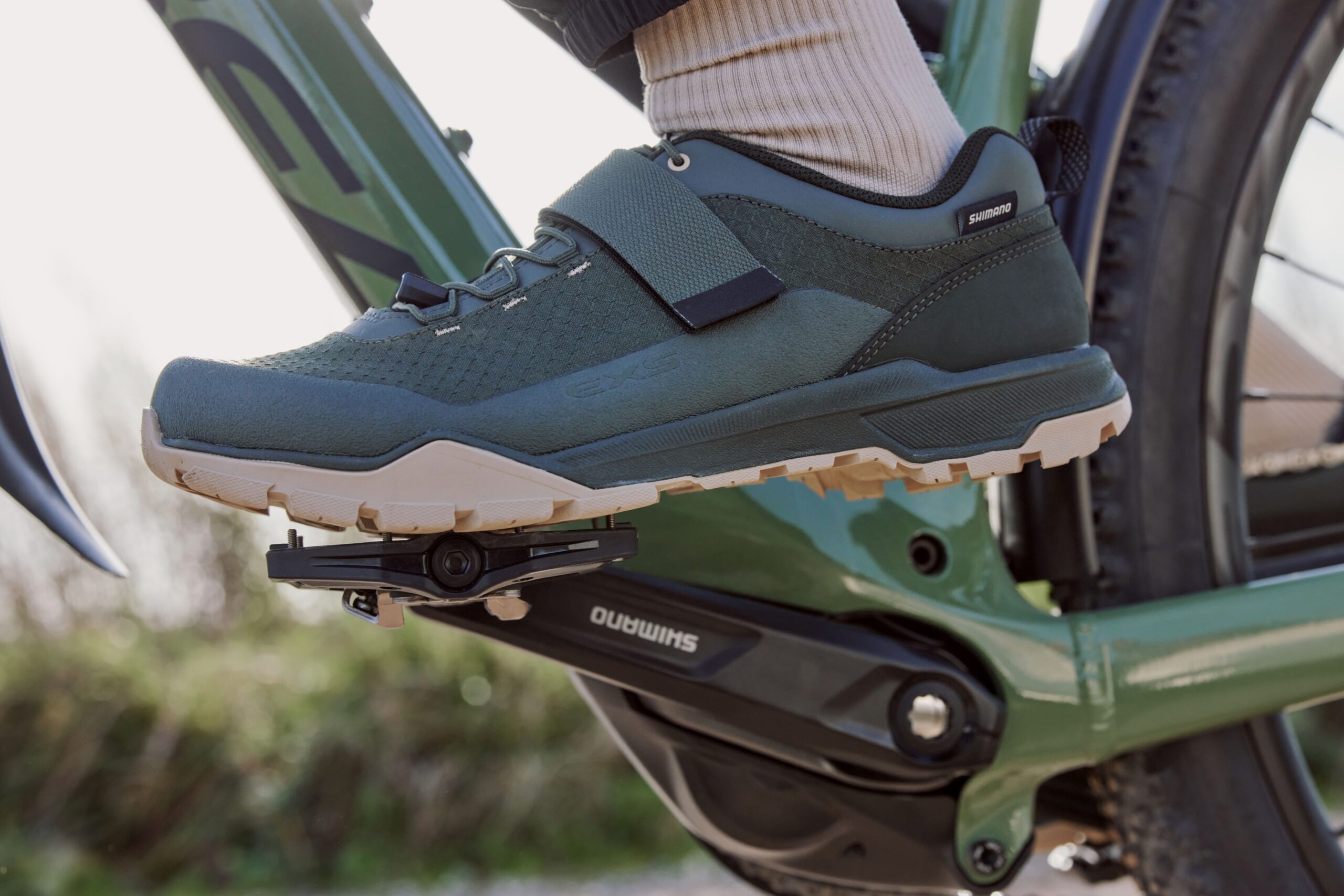 stock image of a shoe resting on the flat pedal side of Shimano's new PD-EH510 hybrid pedal