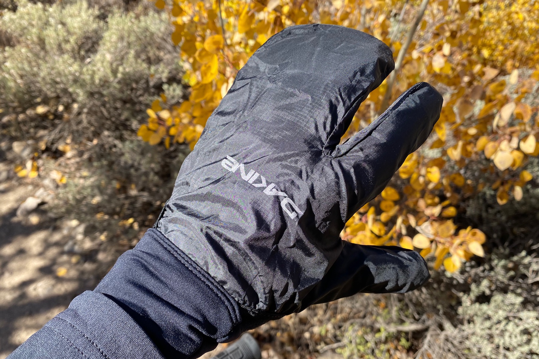 wearing the white knuckle gloves with the rain shell on.