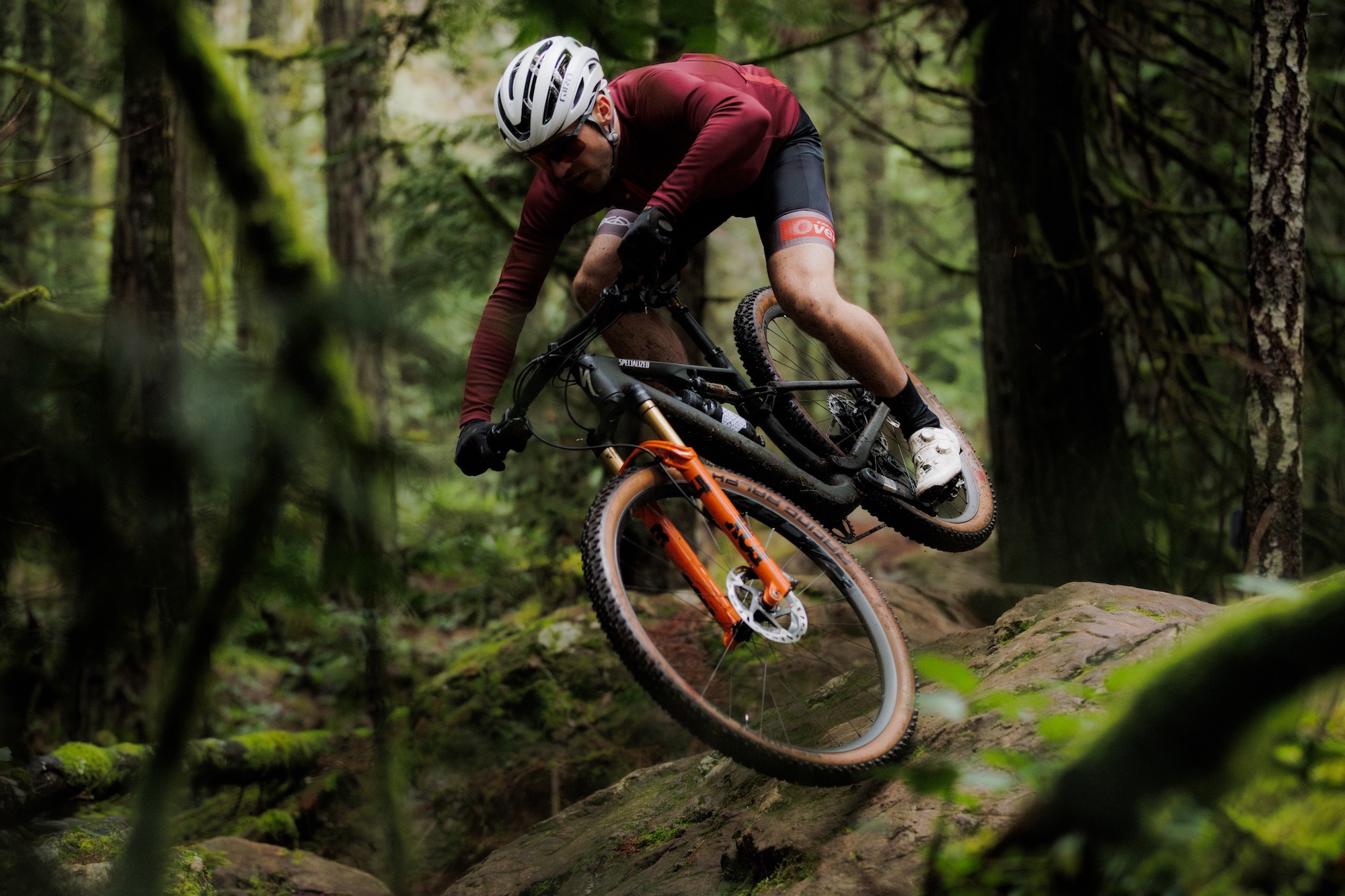 a man riding a short travel mountain bike with the Era SL handlebar