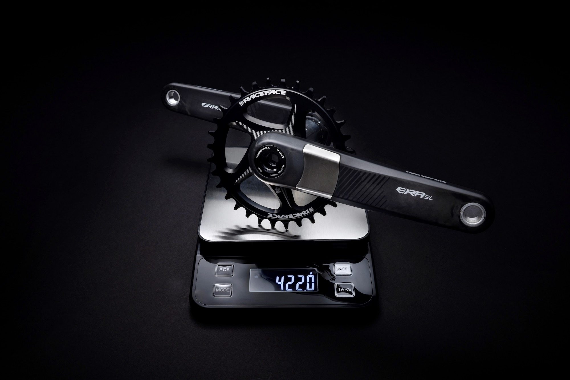 the Race Face Era SL cranks on a scale showing the weight of 422 grams