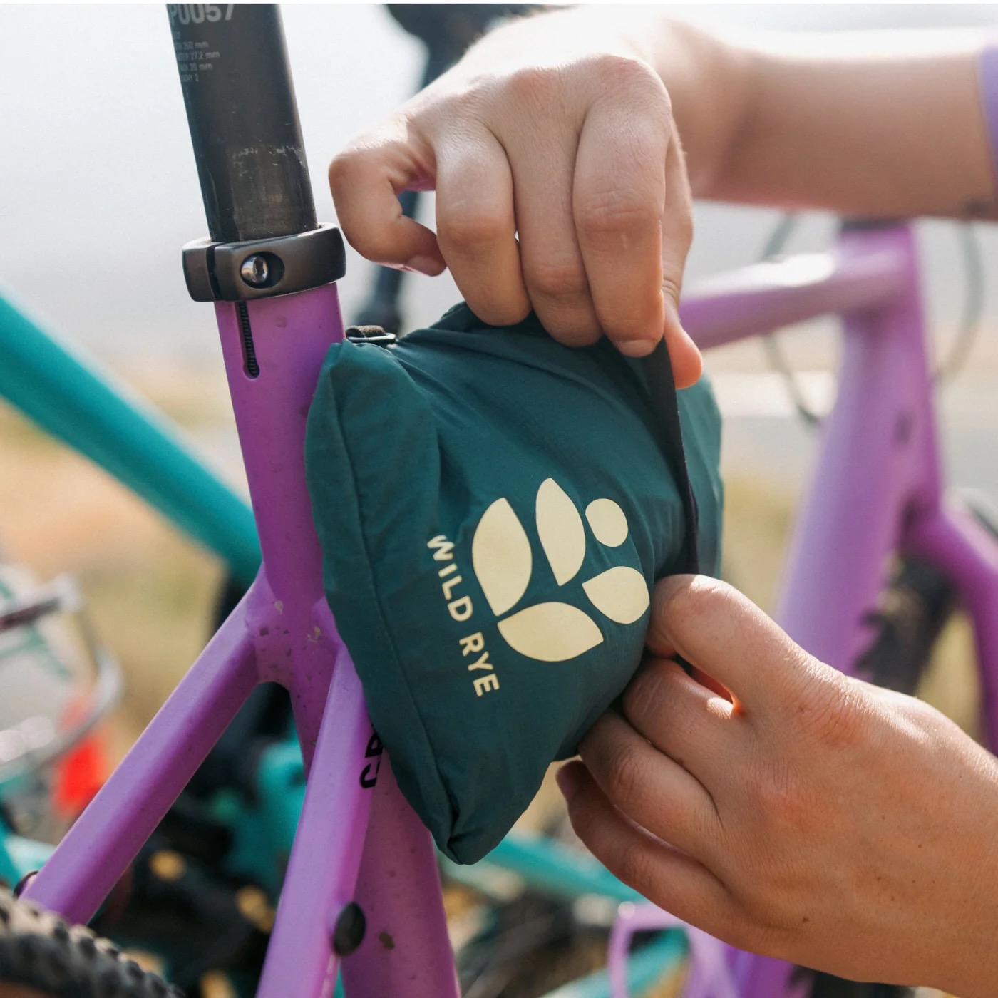 the stuffed Rustler jacket clipped onto a bike frame.