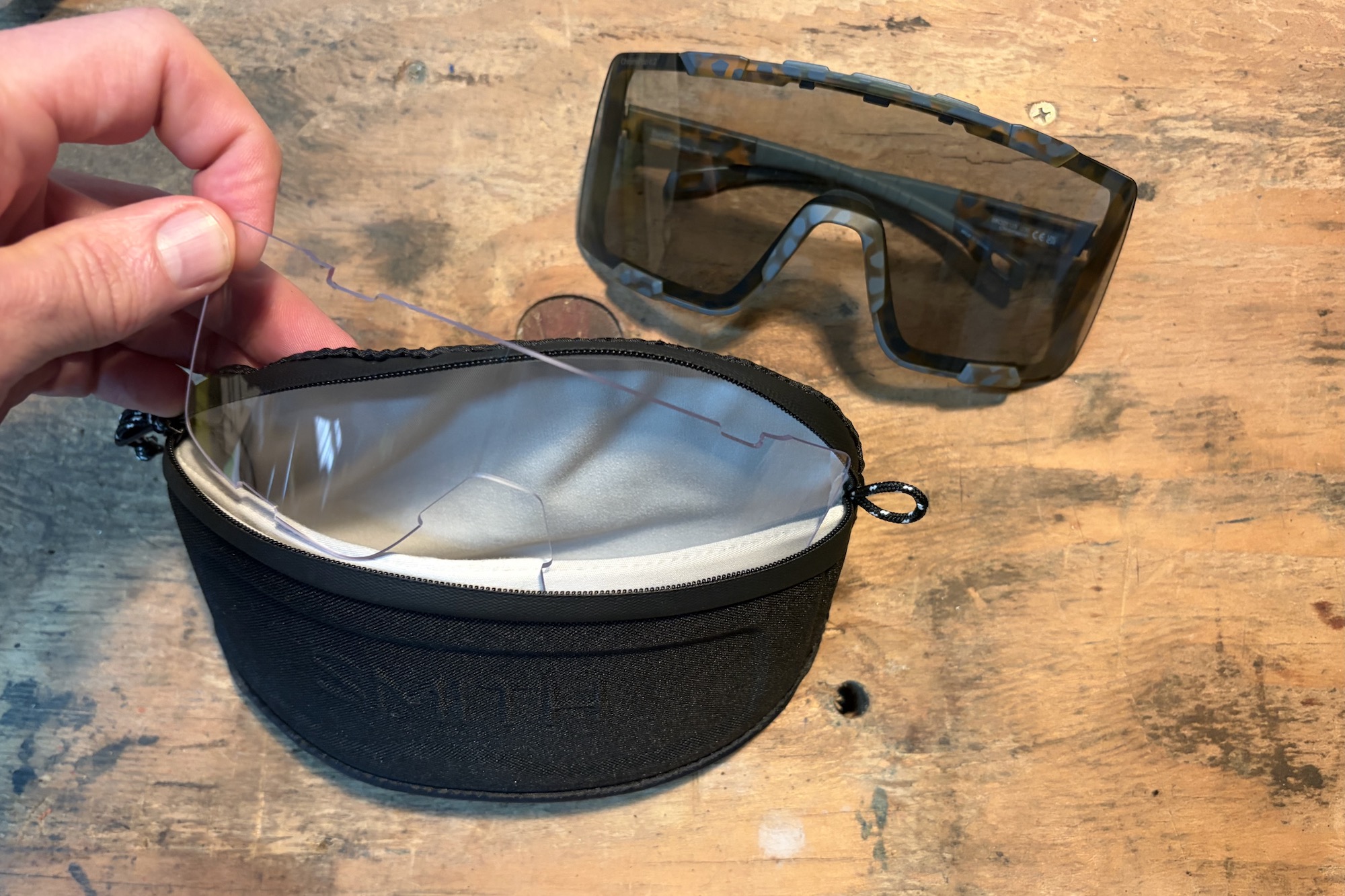 The Syncline glasses with the included storage case and spare clear lens.