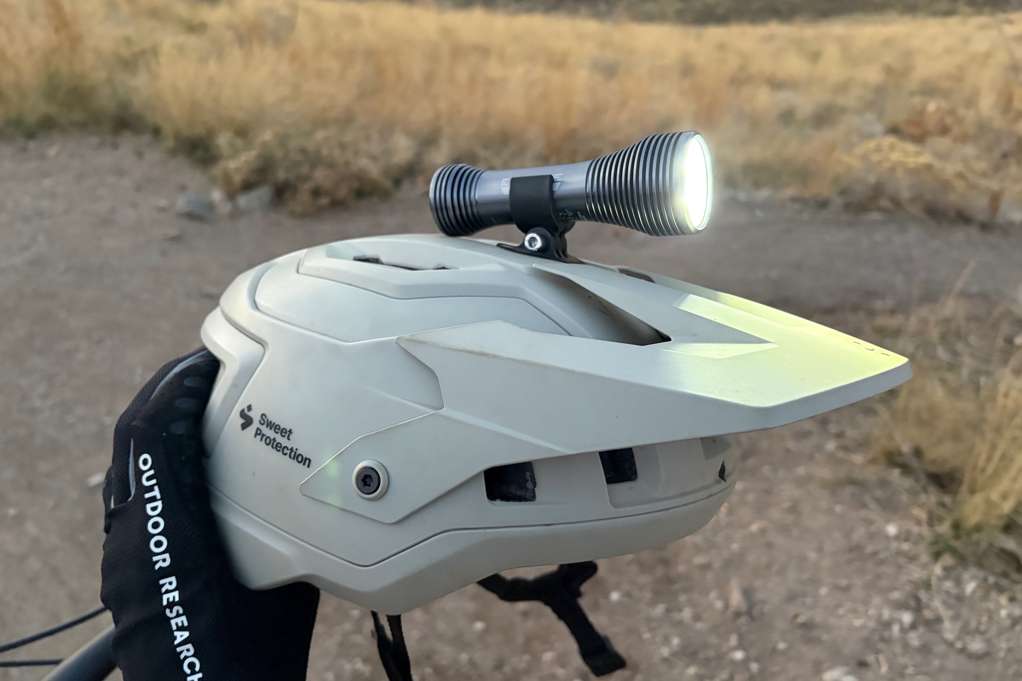 the Exposure Zenith 4 mountain bike light mounted on a bike helmet.