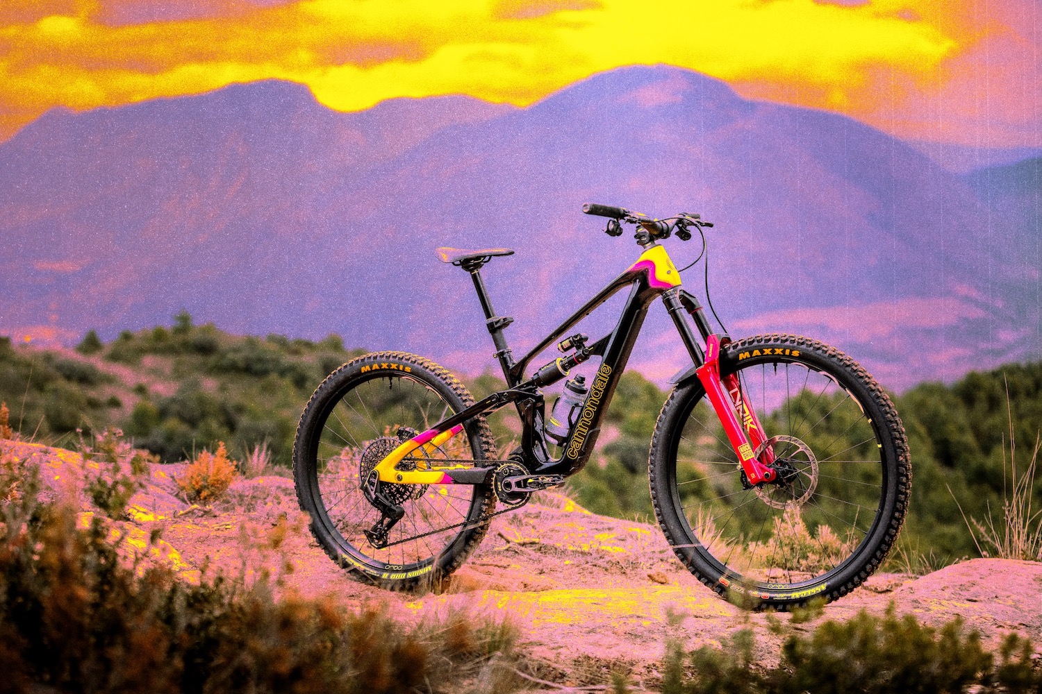 Profile pic of the Cannondale Bad Habit with a moutnain scene and some sunset colors behind.