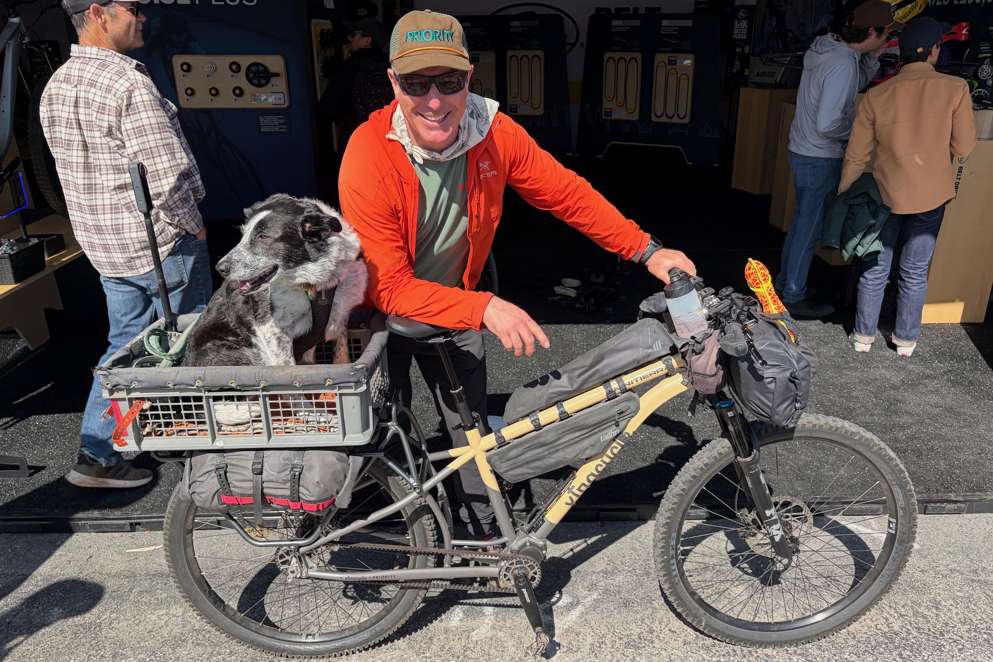 John Freeman and his dog Mira posing with the Xtracycle OmniTierra cargo bike at Sea Otter