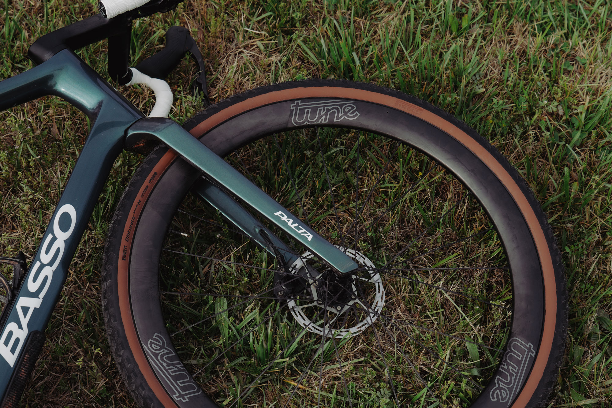 Tune Nano Gravel 45 lightweight all-rounder carbon gravel bike wheels, laying in the grass