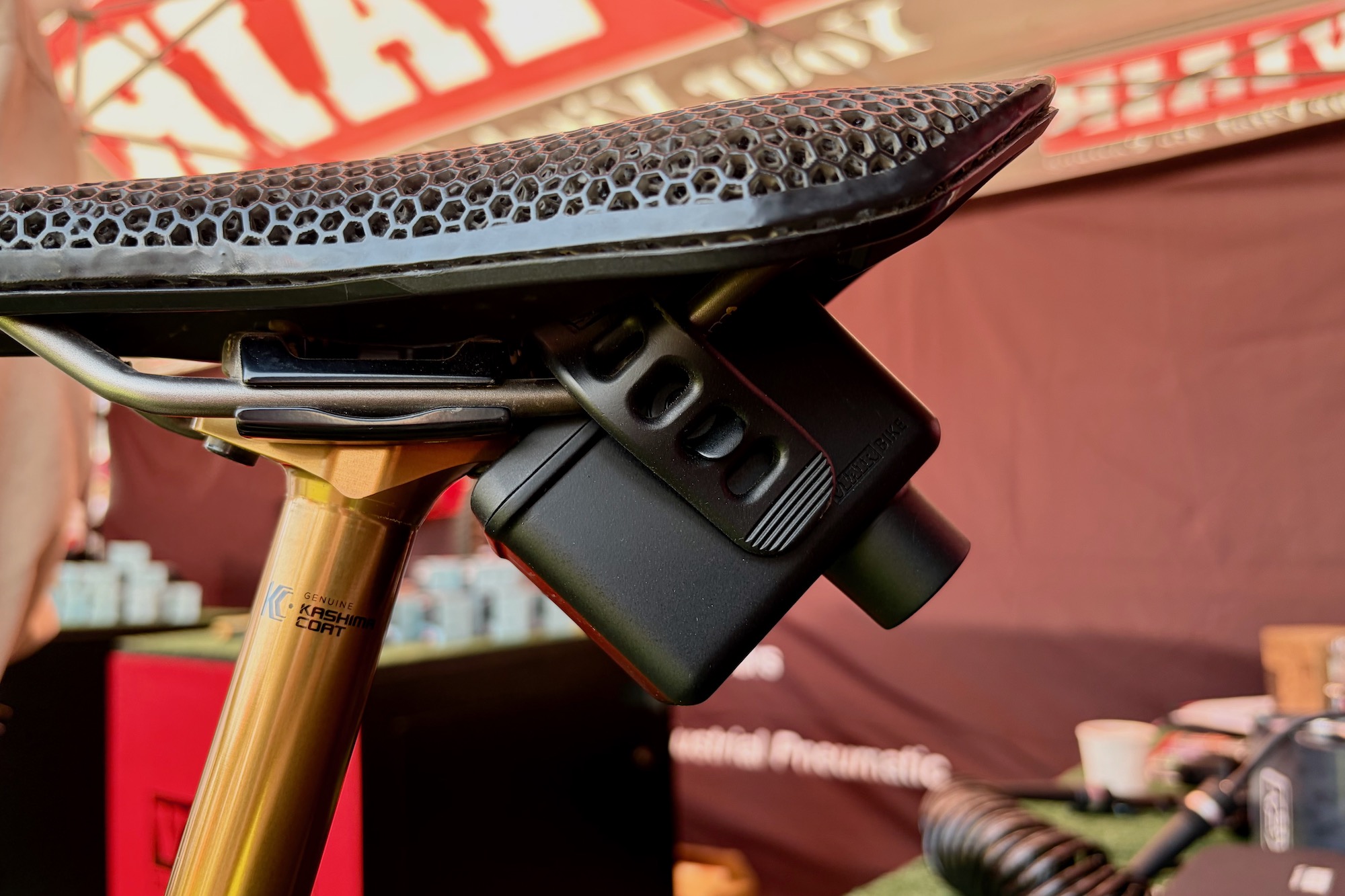 the Viair Recon Mini Case strapped to a bike saddle's rails.