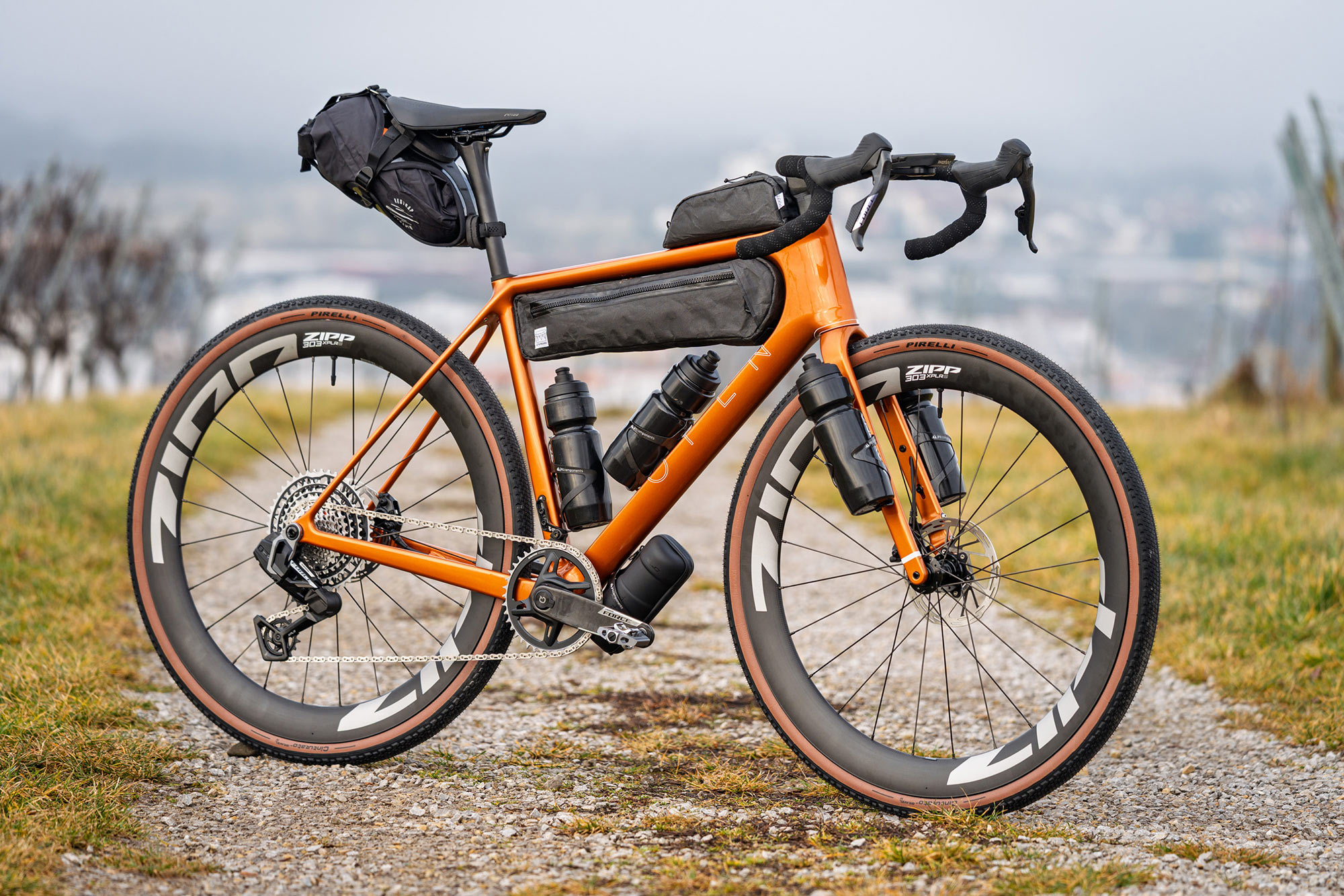 open up 2 adventure gravel bike shown with bags and bottles mounted.