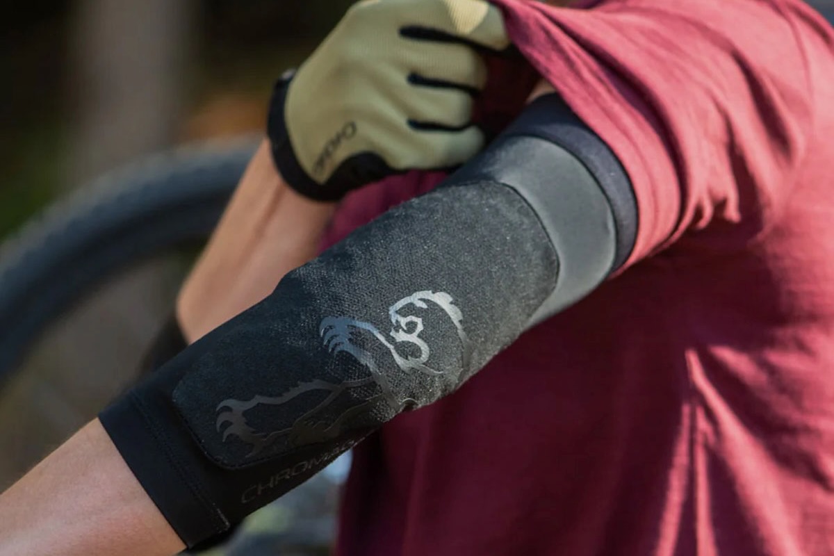 A person wearing the Chromag Shift elbow pads