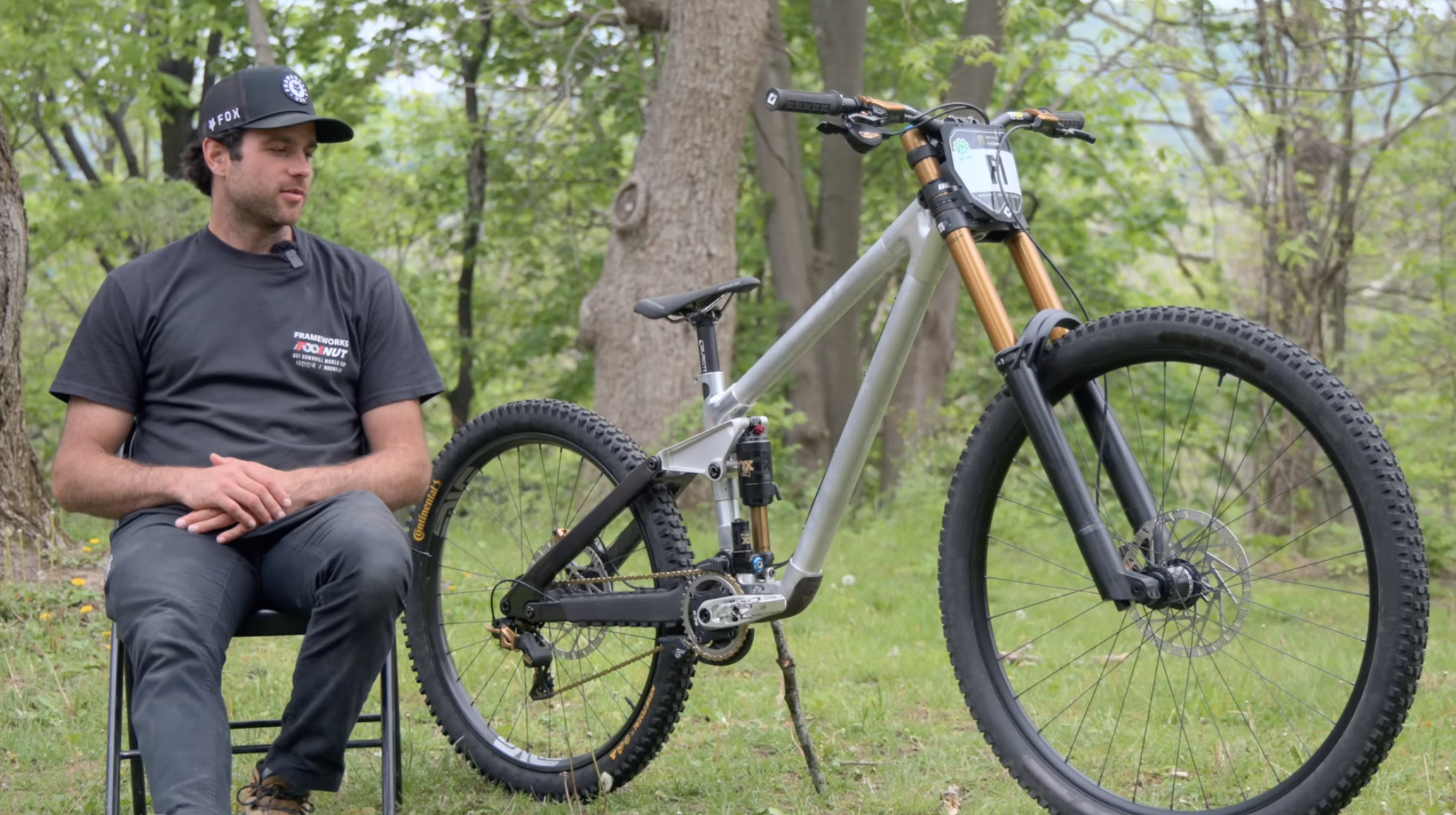 Neko Mullaly sits beside his prototype Frameworks Mega-Mullet with a 32" front wheel