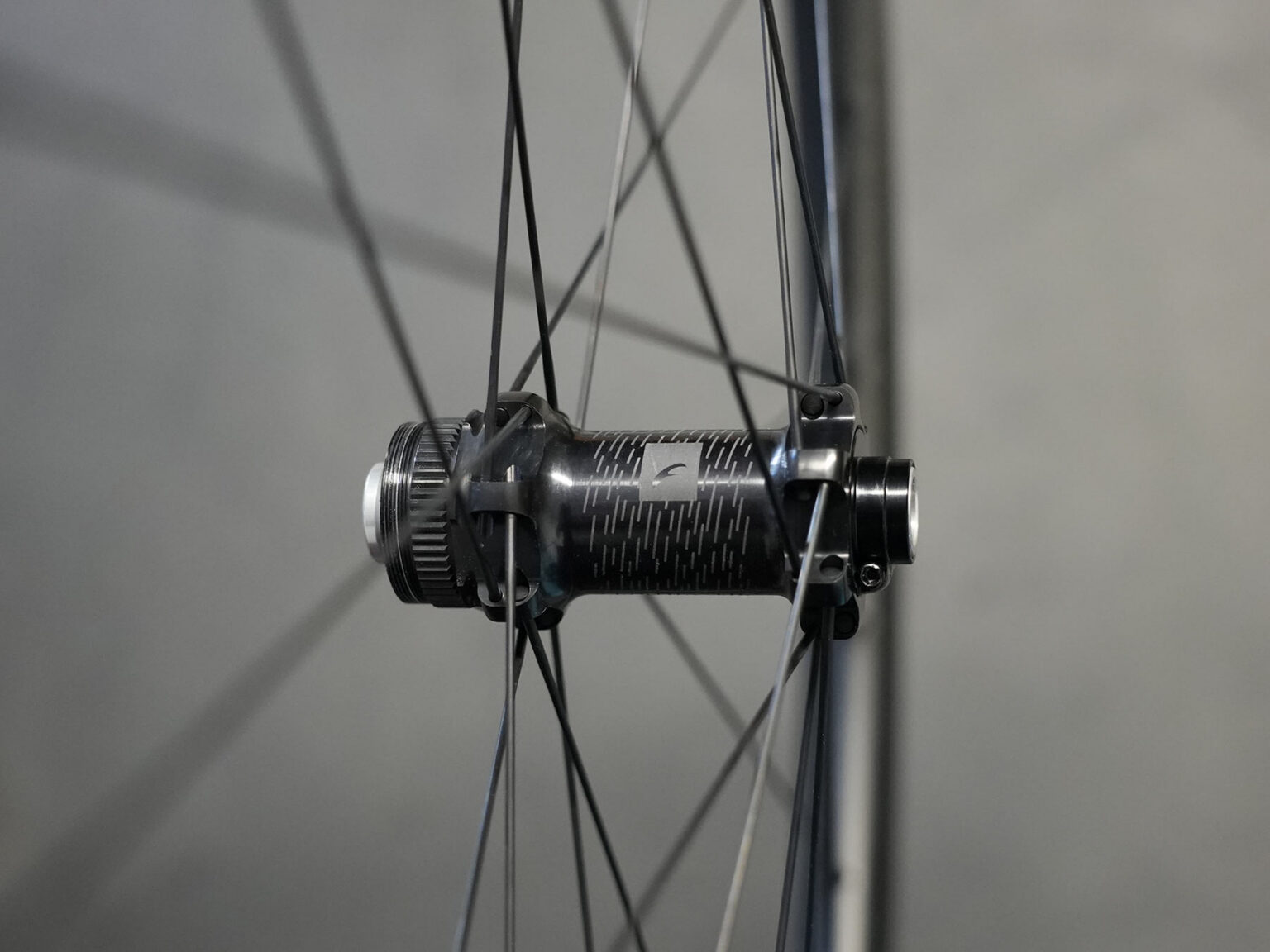 closeup details of hubs on fulcrum rapid red carbon gravel wheels.