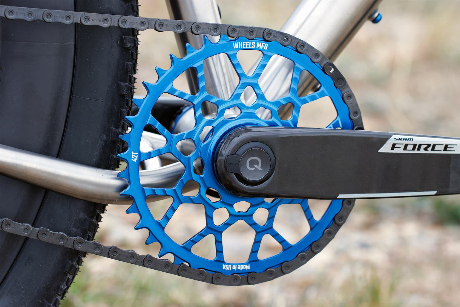 blue gravel chainring from wheels manufacturing on a crankset.
