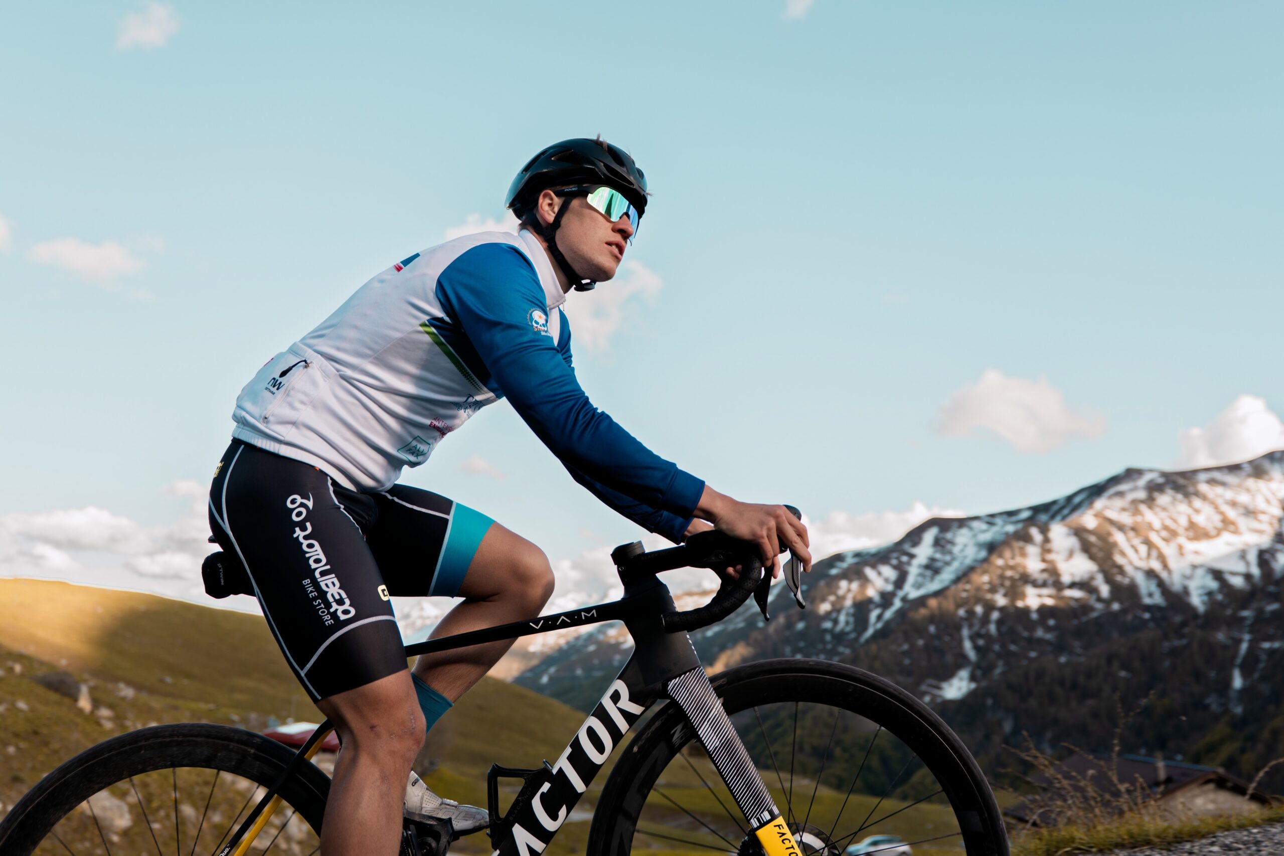 a man riding a road bike while wearing the POVEC C1 sunglasses