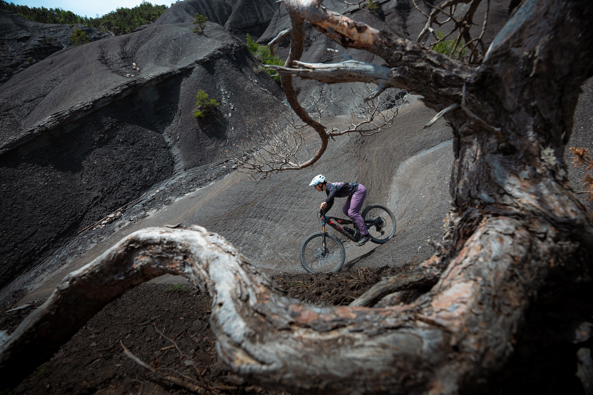 a female rider on the Rotwild R.XX eMTB in some interesting terrain